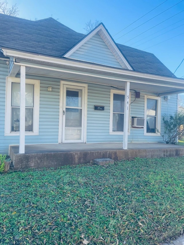 view of front of home featuring cooling unit and covered porch