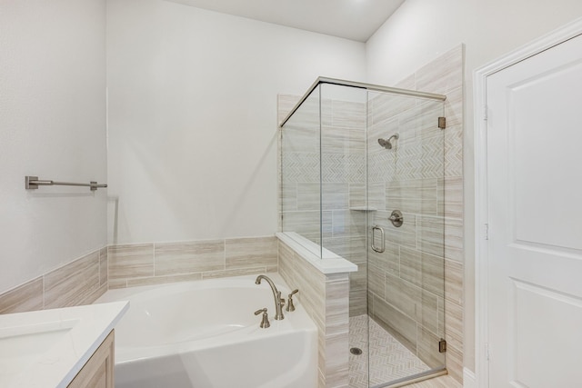 bathroom with separate shower and tub and vanity