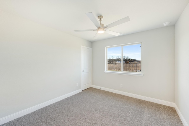 empty room with ceiling fan and carpet flooring