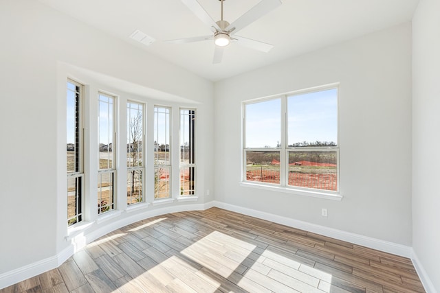 interior space with ceiling fan