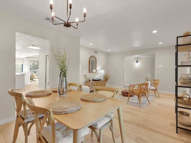 dining area featuring light wood-type flooring