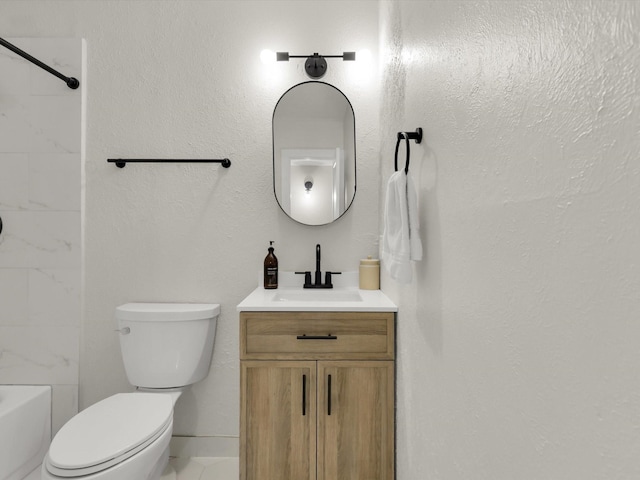 full bathroom featuring tiled shower / bath combo, vanity, and toilet