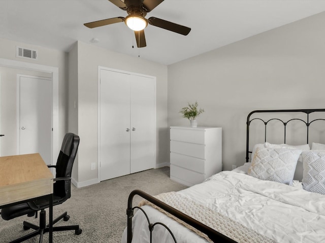 bedroom with light carpet, ceiling fan, and a closet