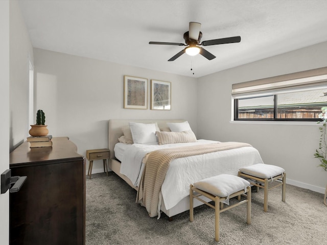 bedroom with dark colored carpet and ceiling fan