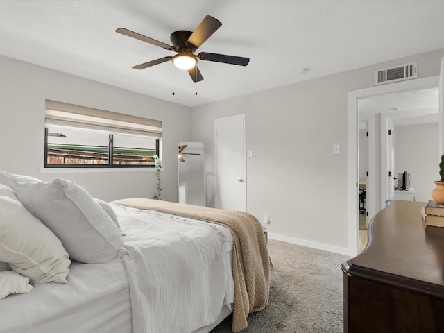 carpeted bedroom with ceiling fan