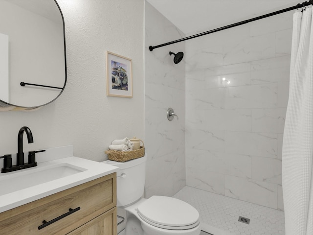 bathroom with vanity, toilet, and a shower with shower curtain