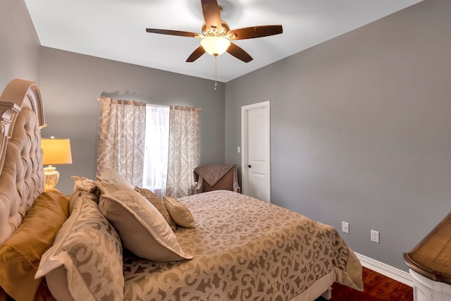 bedroom with wood-type flooring and ceiling fan