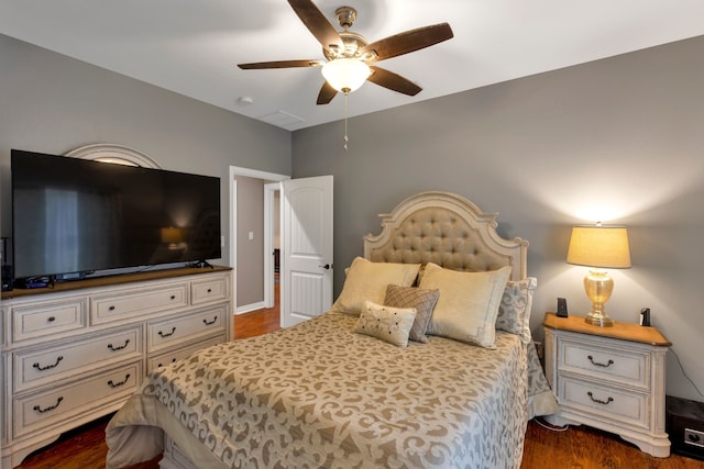 bedroom with dark wood-type flooring and ceiling fan