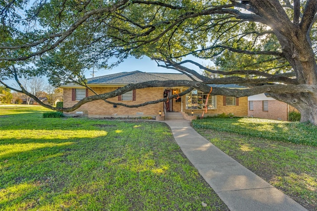 ranch-style house with a front lawn