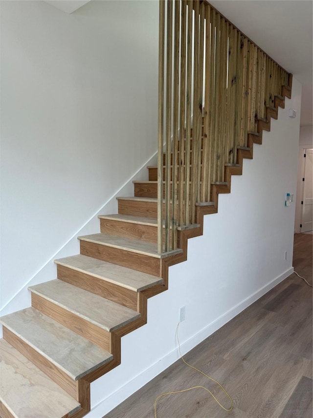 stairway with wood-type flooring