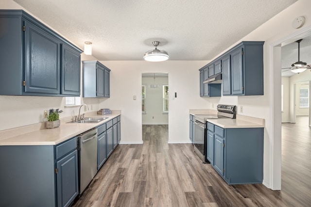 clothes washing area featuring light wood-type flooring, ceiling fan, and crown molding