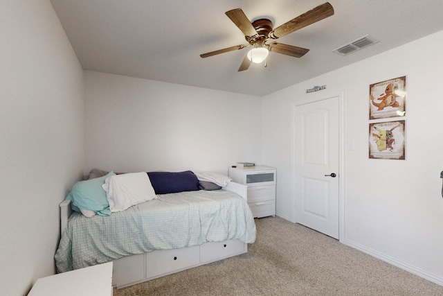 carpeted bedroom with ceiling fan