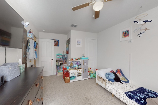 carpeted bedroom featuring ceiling fan