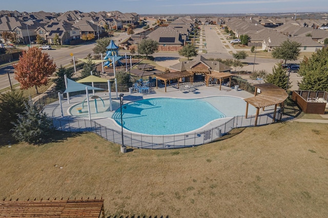 view of swimming pool with a lawn and a patio area