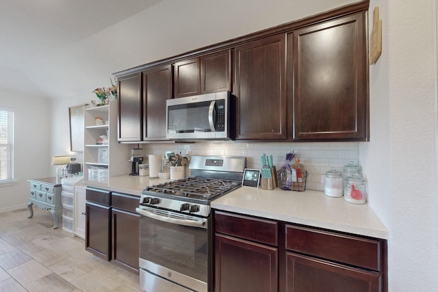 kitchen with tasteful backsplash, stainless steel appliances, and dark brown cabinets