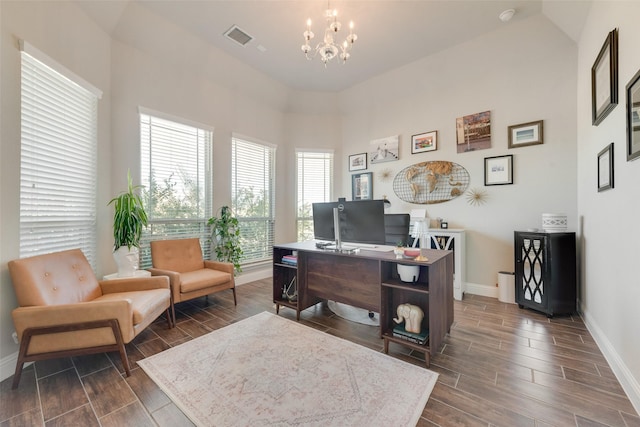 office area with an inviting chandelier