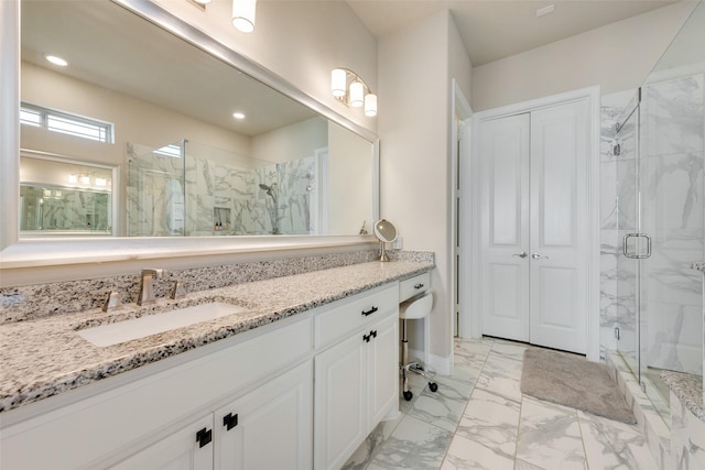 bathroom with vanity and walk in shower