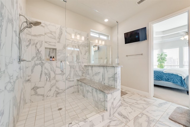 bathroom with ceiling fan and walk in shower