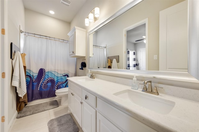 bathroom with vanity, tile patterned floors, a shower with curtain, ceiling fan, and toilet