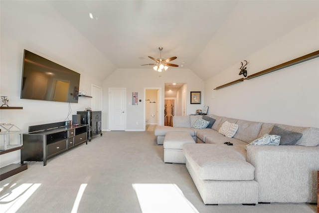 carpeted living room featuring ceiling fan and lofted ceiling