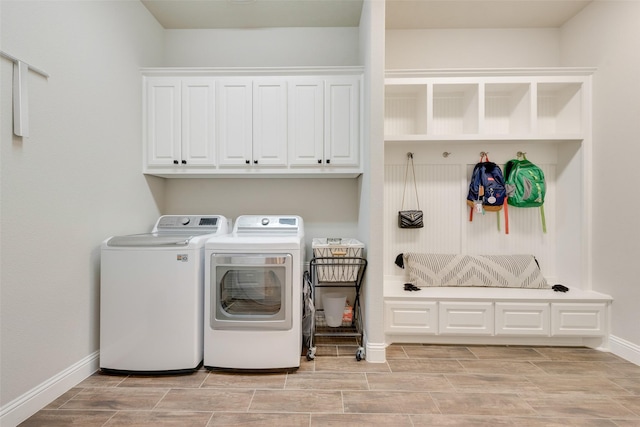 laundry room with cabinets and washer and dryer