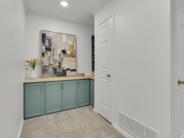 hallway with light colored carpet