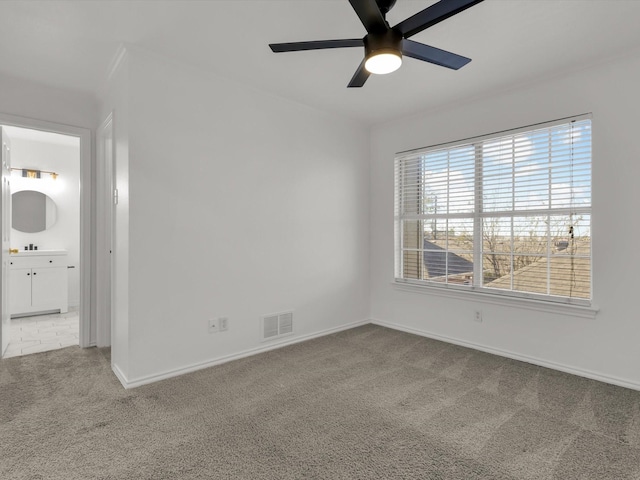 empty room with carpet and ceiling fan