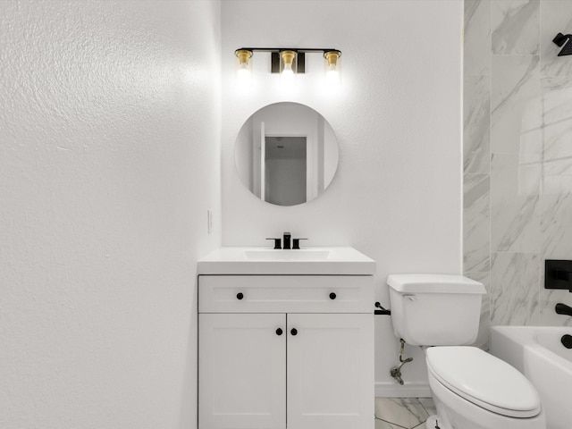 full bathroom featuring vanity, tiled shower / bath combo, and toilet