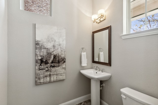 bathroom with toilet and sink