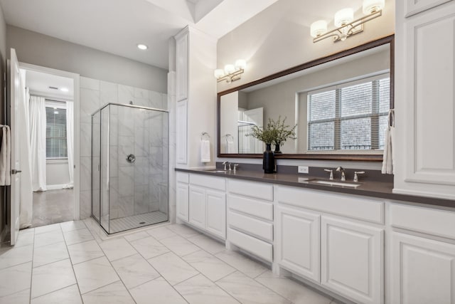 bathroom featuring vanity and an enclosed shower