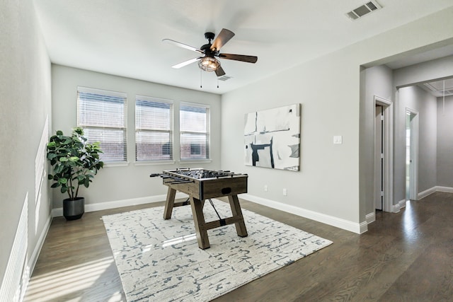 rec room with ceiling fan and dark hardwood / wood-style floors