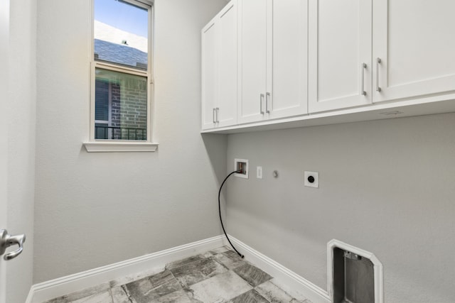 clothes washing area featuring gas dryer hookup, cabinets, hookup for a washing machine, and electric dryer hookup