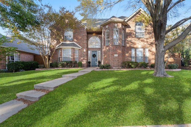 front facade featuring a front lawn