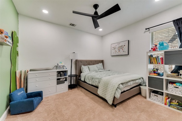 bedroom featuring light colored carpet and ceiling fan