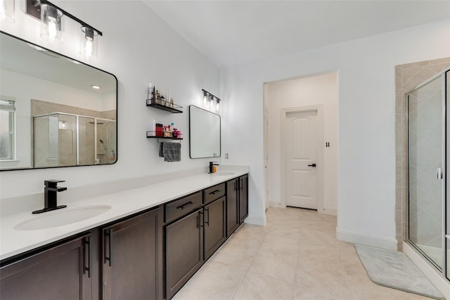 bathroom featuring tile patterned floors, vanity, and an enclosed shower