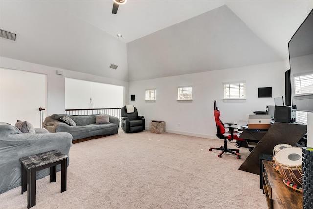 interior space featuring carpet, ceiling fan, and a wealth of natural light