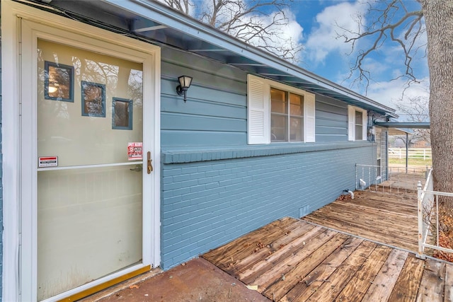 entrance to property with a deck