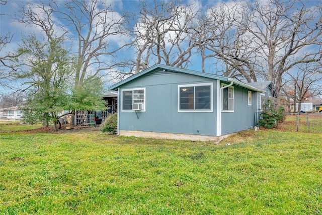 view of home's exterior featuring a yard and cooling unit