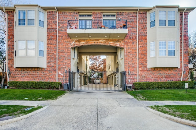 view of exterior entry featuring a balcony