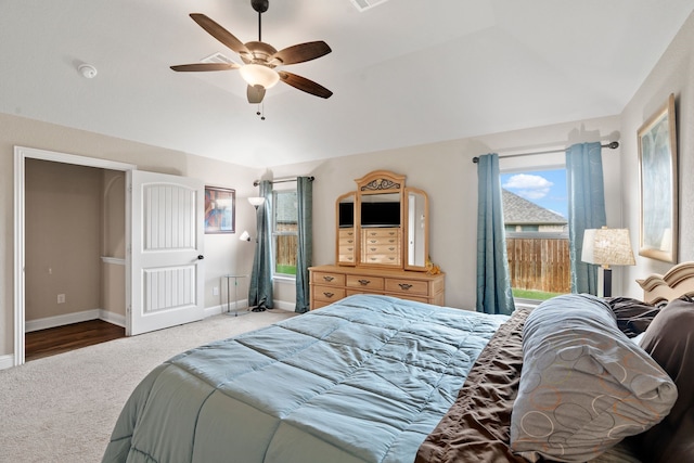 bedroom with lofted ceiling, ceiling fan, and carpet flooring