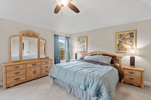 bedroom with ceiling fan and light carpet