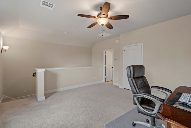 office area with vaulted ceiling, light colored carpet, and ceiling fan