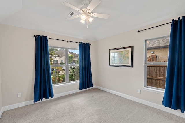 spare room featuring carpet floors and ceiling fan