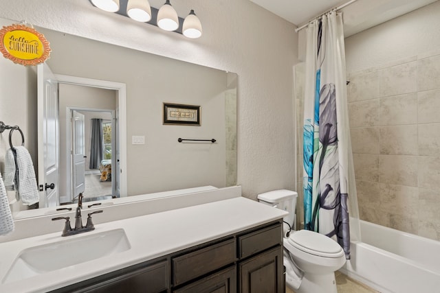 full bathroom featuring vanity, toilet, and shower / tub combo