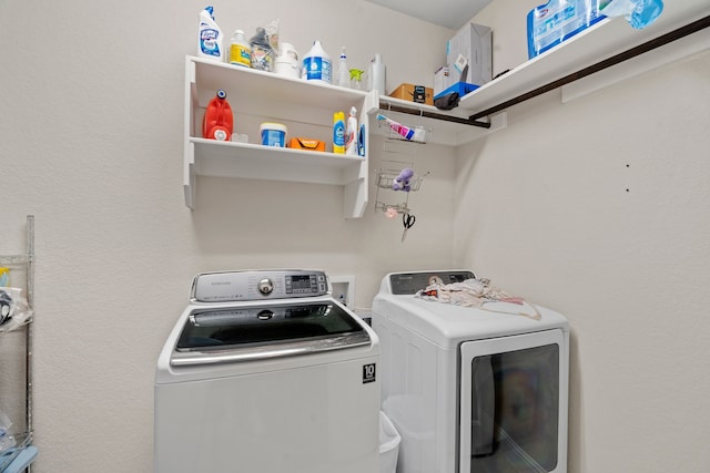 washroom with separate washer and dryer