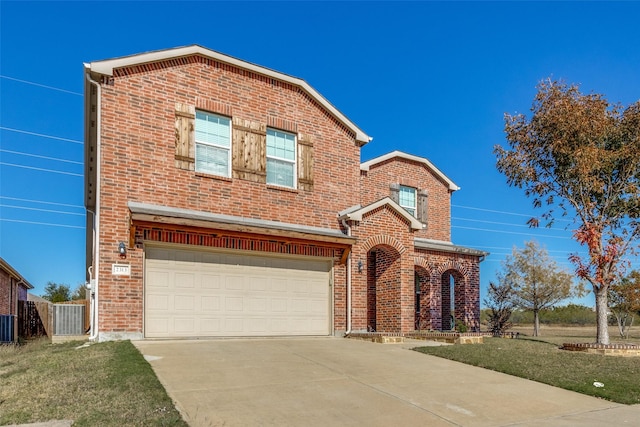 view of property featuring central AC unit and a garage