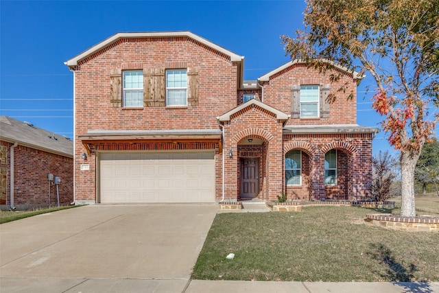 view of property featuring a front yard and a garage