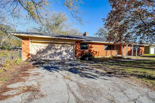 single story home with a garage