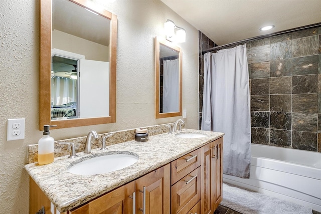 bathroom featuring vanity and shower / tub combo with curtain