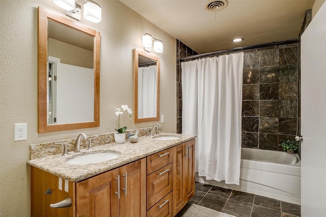 bathroom featuring shower / tub combo with curtain and vanity